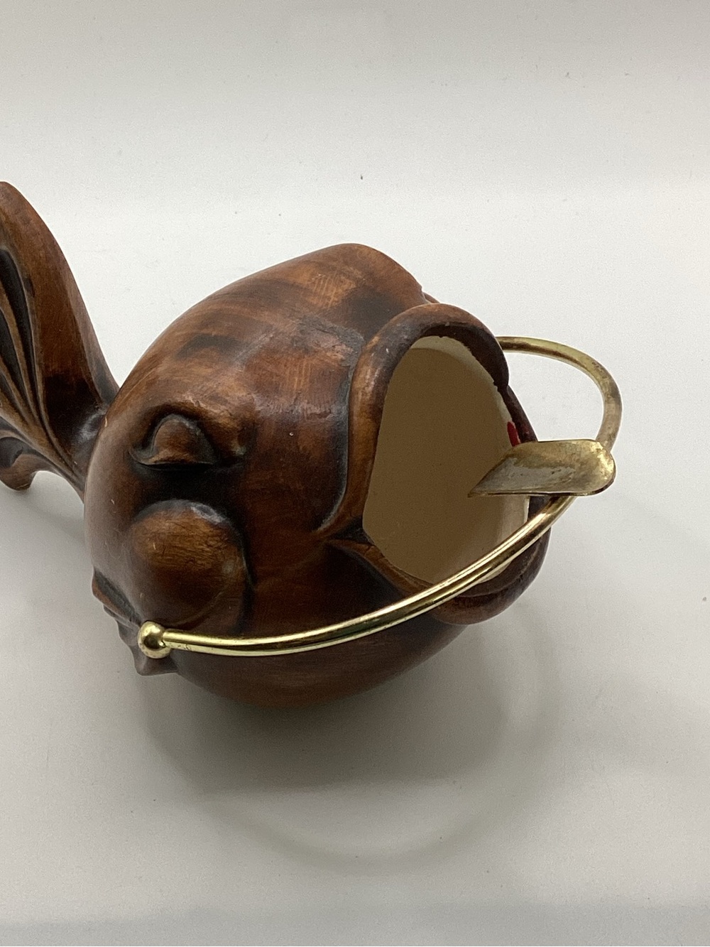 vintage 1956 Treasure Craft ceramic puffer fish ashtray with a brass wire handle